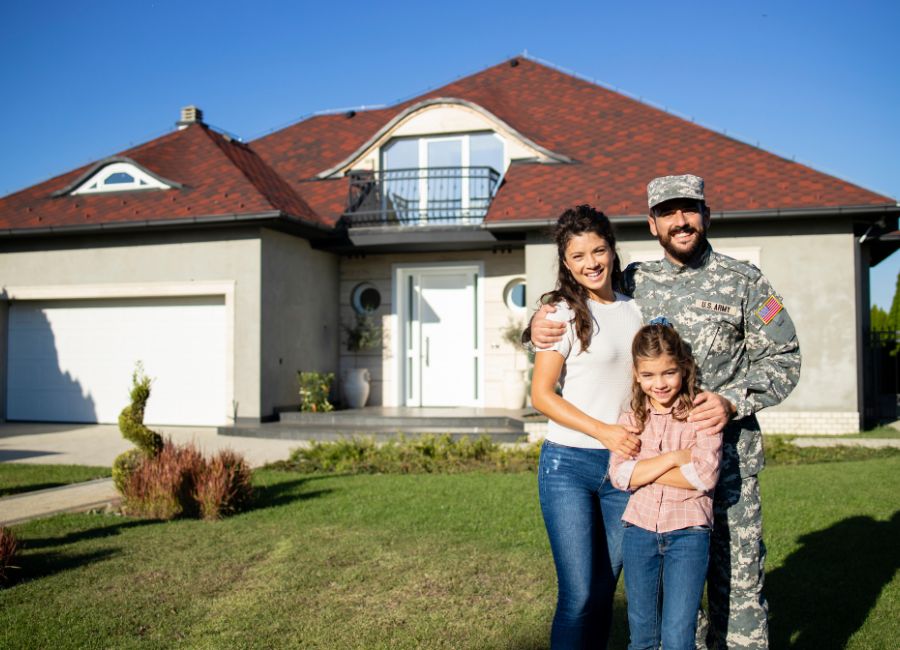 Veteran family in front of their new home